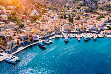 View on Symi (Simi) island harbor port, classical ship yachts, houses on island hills, Aegean Sea...