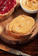 Obraz na płótnie Canvas smooth peanut butter and jam bread toast, american traditional sandwich