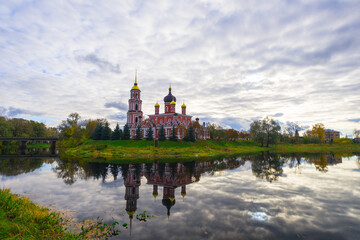 Fototapeta na wymiar Cathedral of the Resurrection of Christ with belfry on the river Polist in the ancient Russian city of Staraya Russa