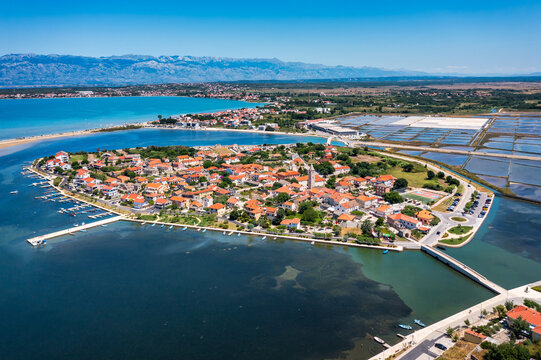Historic town of Nin laguna aerial view with Velebit mountain background, Dalmatia region of Croatia. Aerial view of the famous Nin lagoon and medieval in Croatia