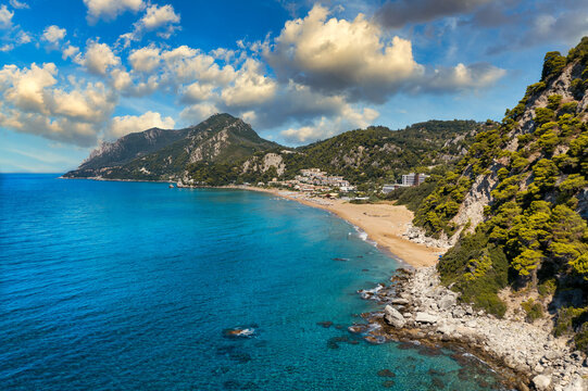 Aerial drone view over western coast and Glyfada beach, Island of Corfu, Greece. Glyfada Beach at Corfu Greece during the day.
