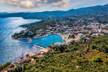 Naklejka premium Kassiopi, town in Corfu, Greece. Mediterranean town Kassiopi in Greece. Greek resort on Corfu island.