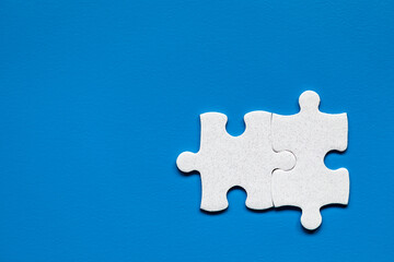 Obraz premium Closeup of jigsaw puzzle isolated. Missing jigsaw puzzle piece, business concept for completing the puzzle piece. Group of puzzle and a puzzle piece. Teamwork concept. Think difference concept.