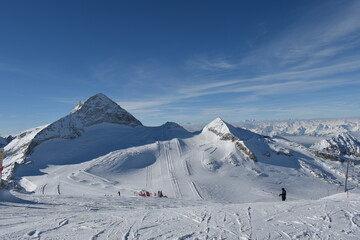 Sunny day on a Hintertux glacier (photo taken from 3250 meters above sea level) with view of Tirol Alps