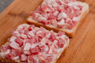 Two home made sandwiches on wooden background in white background