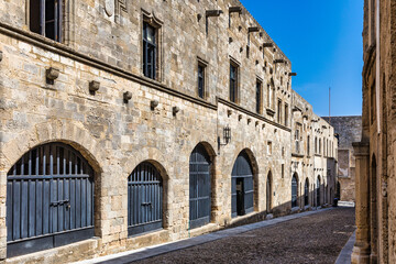 Obraz premium The Street of the Knights, the most famous street in Rhodes old town, Rhodes island, Greece. The Street of the Knights in Rhodes is one of the best preserved medieval monuments in the world. Greece