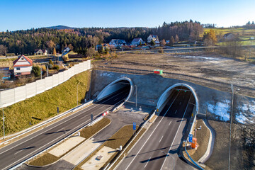 Newly opened tunnel on Zakopianka highway in Poland in November 2022. The tunnel is 2 over km long and makes travel from Krakow to Zakopane, Podhale region and Slovakia much faster. Old road above - obrazy, fototapety, plakaty