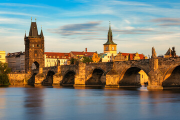 Charles Bridge sunset view of the Old Town pier architecture, Charles Bridge over Vltava river in...