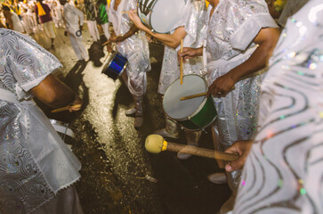Street carnival. Band, musicians, people playing samba seen up close. Rio de Janeiro, Brazil.