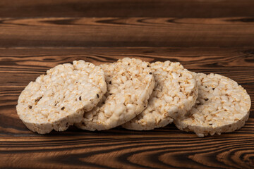 Rice cakes on an old brown tree. Diet bread. Useful food. Diet food. Gluten free. Space for copy. Space for text.