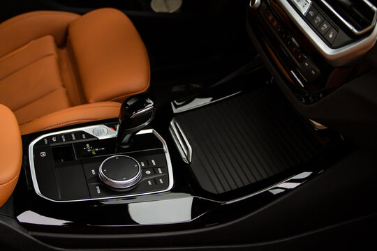 MOSCOW, RUSSIA - FEBRUARY 05, 2022 The BMW idrive console. Central console of the new BMW iDrive. The iDrive button in BMW interior.