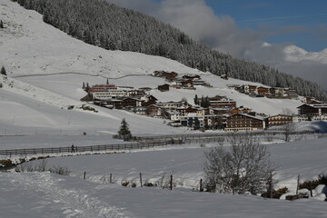 Austrian village under snow on a sunny, winter day