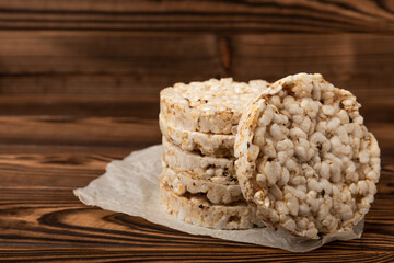 Rice cakes on an old brown tree. Diet bread. Useful food. Diet food. Gluten free. Space for copy. Space for text.