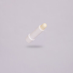 Hygienic lip balm levitating on gray background with shadow