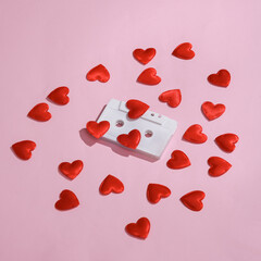 Audio cassette with hearts on a pink background. Love concept, valentine's day, february 14th celebration, creative layout