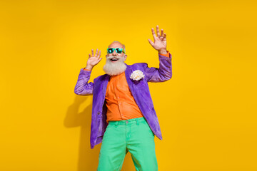 Photo portrait of attractive grandpa nightclub dancer retro vintage festive wear trendy colorful look isolated on yellow color background