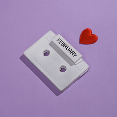 Creative valentine's day layout with audio cassette on purple background