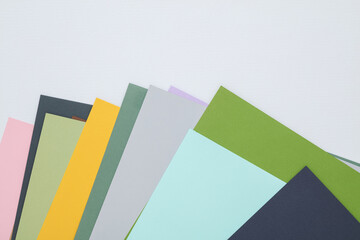 Colored sheets of paper for creativity on a gray background