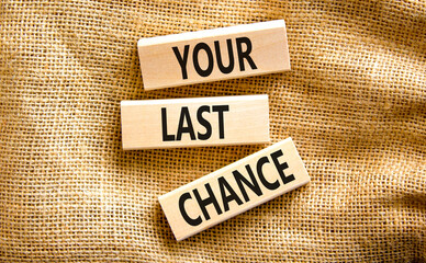 Time to your last chance symbol. Concept words Your last chance on wooden blocks on a beautiful canvas table canvas background. Business and your last chance concept. Copy space.