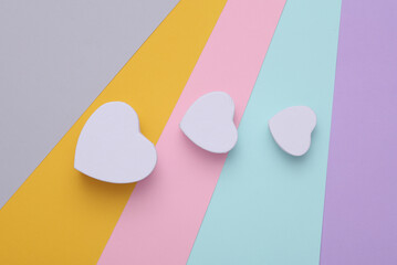 White boxes in the form of hearts on a colored background. Valentine's day mockup