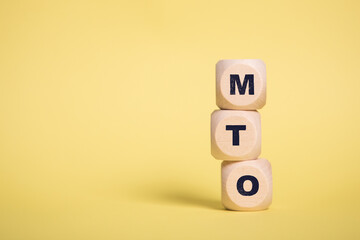 MTO, Make to Order acronym letters on wooden blocks isolated on light Yellow background copy space