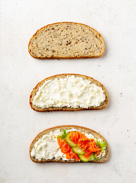 Three Slices Of Bread. Three Steps Of Making Cream Cheese And Salmon Sandwich, Overhead Shot