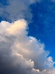 Fototapeta na wymiar Fluffy white clouds in the blue sky