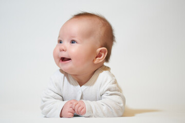 portrait of a smiling baby on a white background