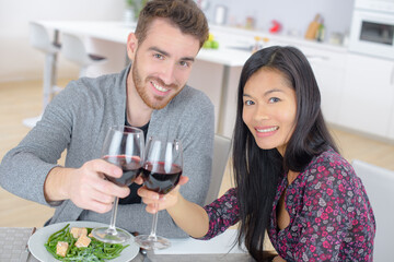 Couple having meal with wine