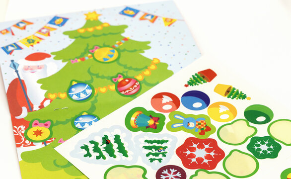 Book with children's christmas stickers with Christmas tree and decorations. High quality photo