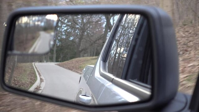 Closeup Truck Mirror Picture In Picture View Driving Trails In Forested Area Park 002
