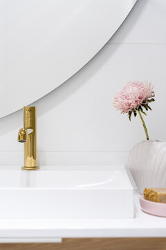 Golden bathroom tap, close-up