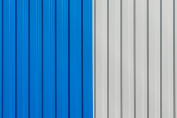 Blue and white vertical lines sheet metal plate corrugated texture steel fence background