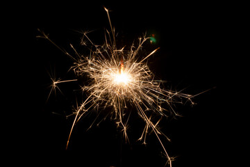 Burning sparklers on a black background