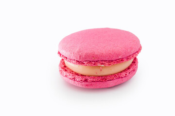 Pink French macaroon isolated on white background. Tasty colourful macaroons. Cookie made of two smooth halves, fastened with stringy fillings. French pastry made from egg whites.