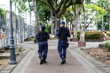 Two municipal guards patrolling the streets of Campo Grande square