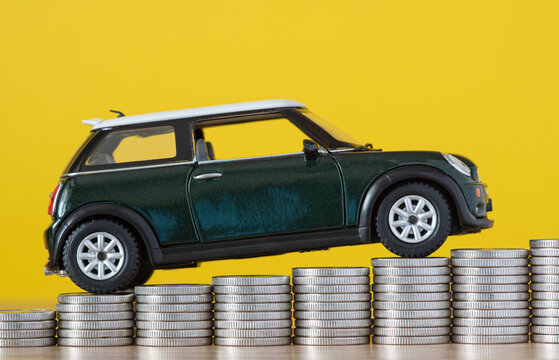 The toy car climbs up the manets