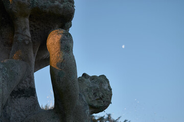 Stone statue with the moon