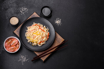 Delicious fresh rice noodles with shrimp, spices and herbs