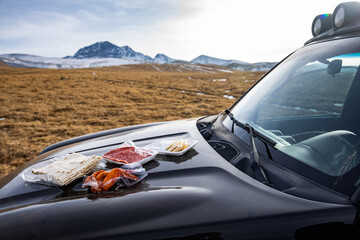 food on the hood of a car