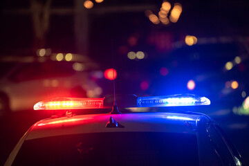 Police car with flashing lights on © Daniel