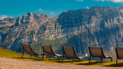 Beautiful alpine summer view with relaxation chairs at the famous Kronberg mountains, Appenzell, Alpstein, Switzerland