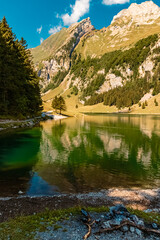 Beautiful alpine summer view with reflections at the famous Seealpsee lake, Appenzell, Alpstein, Switzerland