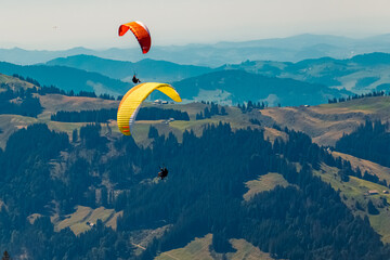 Beautiful alpine summer view with paragliders at the famous Ebenalp, Appenzell, Alpstein, Switzerland