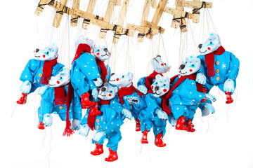 Lots of Bear puppets on strings in Christmas costumes