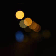 Blurred street lights in the night. Copy space. square format