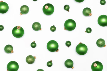 Christmas flatlay backdrop composition of different size green balls on the white background