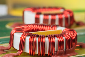 Electronic components electromagnetic coil inductor on circuit board close-up