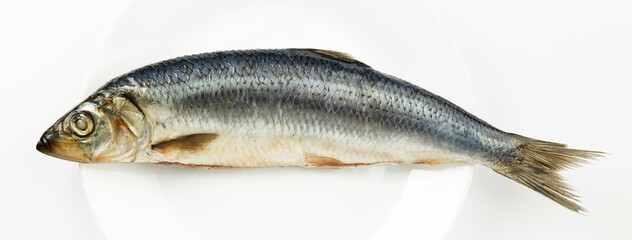 Salted herring on a white background, close-up.