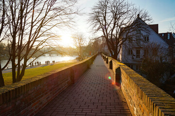 Scenic view of the Ulm City with its famous brick city wall and ancient houses on a sunny winter evening in December in Germany (Germany, Europe)